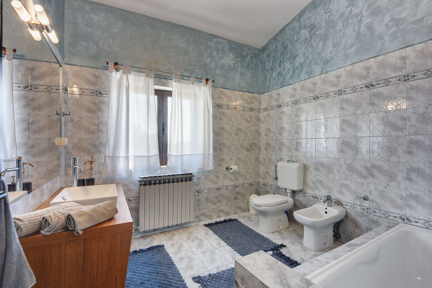 Large family bathroom with bathtub and bidet