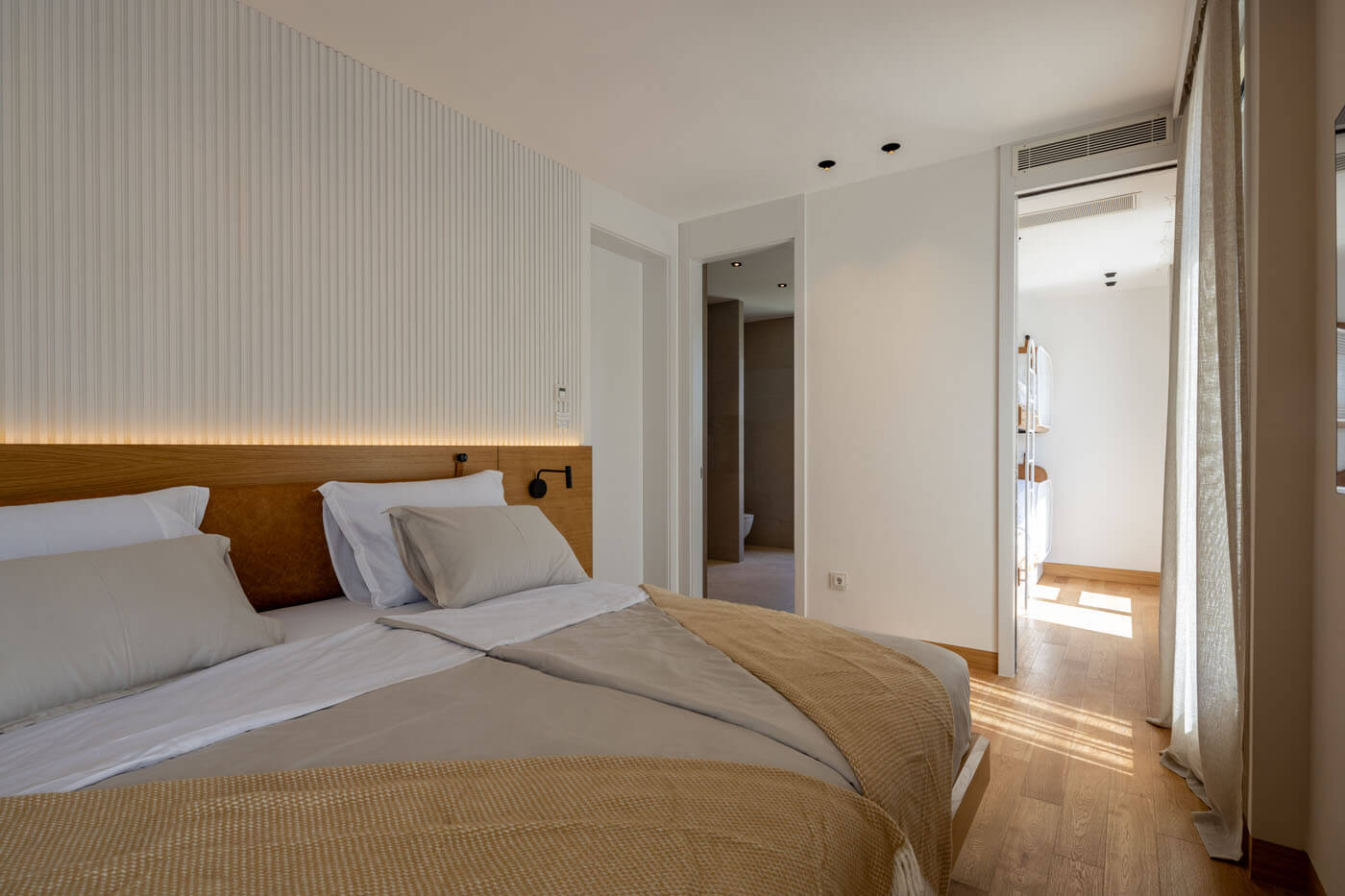 Double bedroom and adjoining room with bunk beds