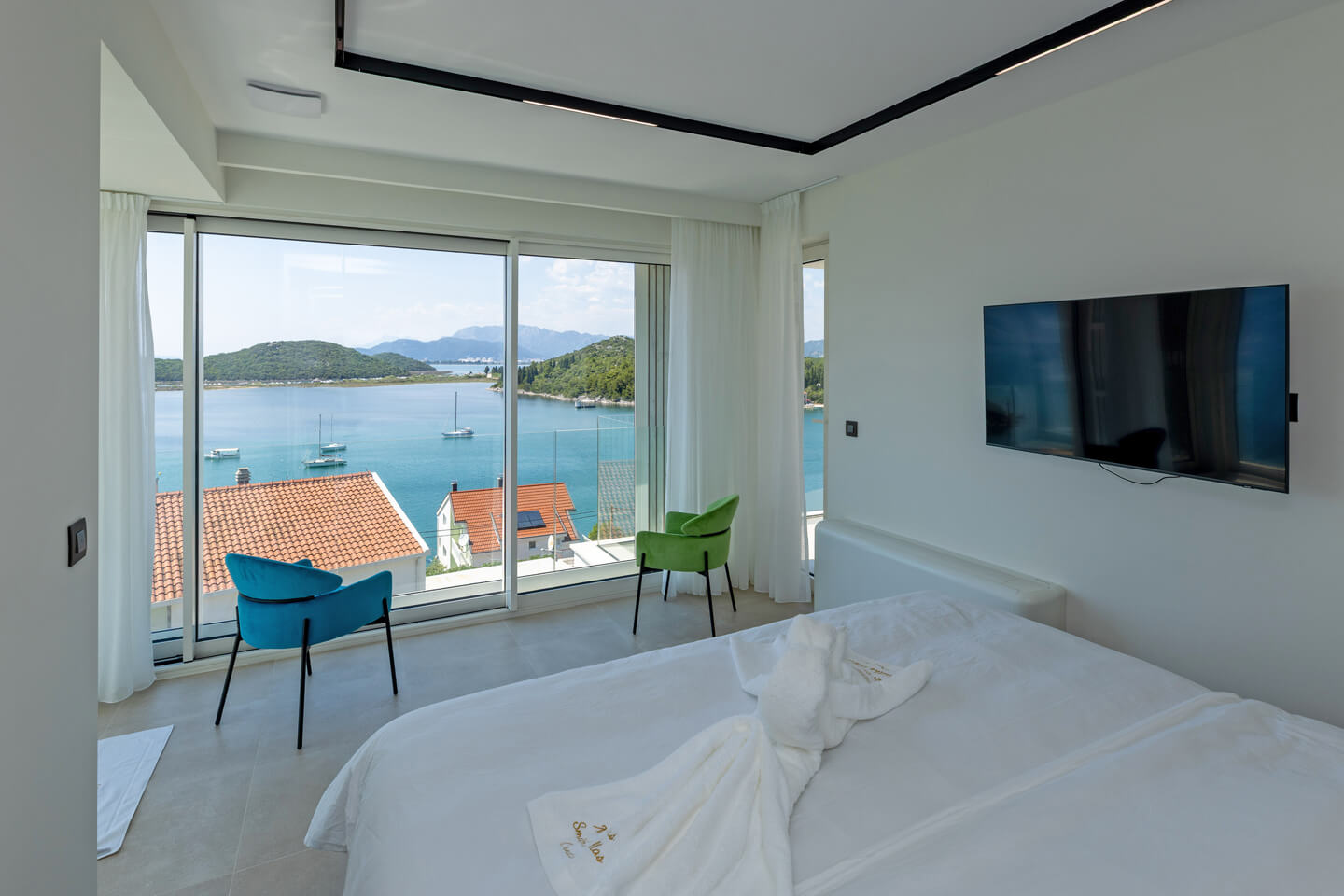 First floor bedroom 1 with TV and view