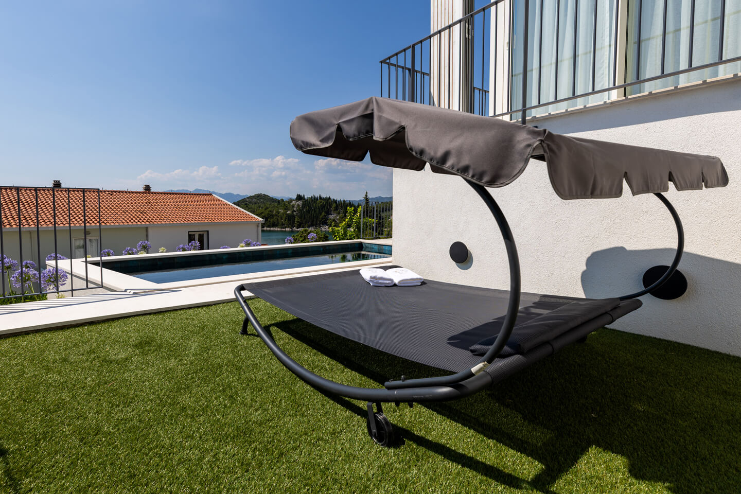 Ground floor day bed by pool