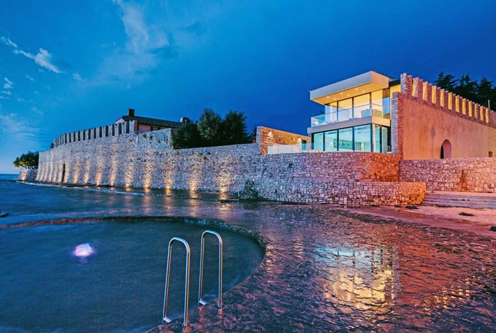Evening view of Novigrad walls and  swimming area